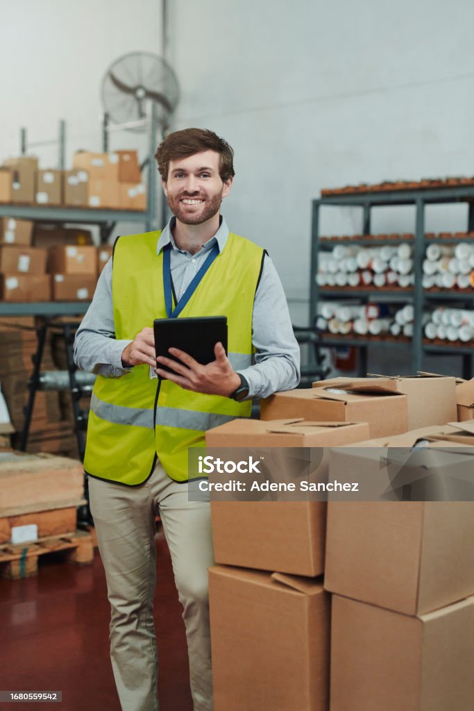 Professional warehouse worker with tablet in modern fulfillment facility
